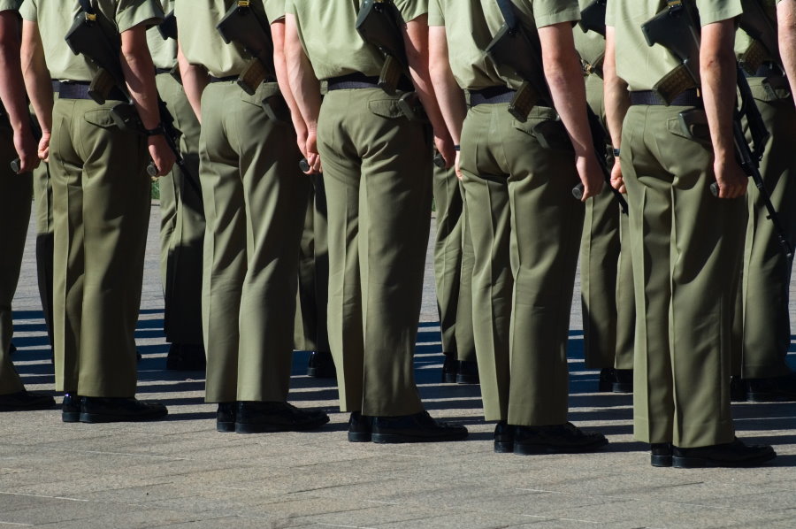 Soldiers from the Australian Defence Force standing to attention