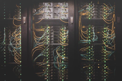 A row of IT server racks with operational servers running inside