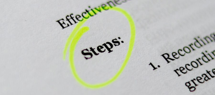 The text "steps" highlighted on a paper document